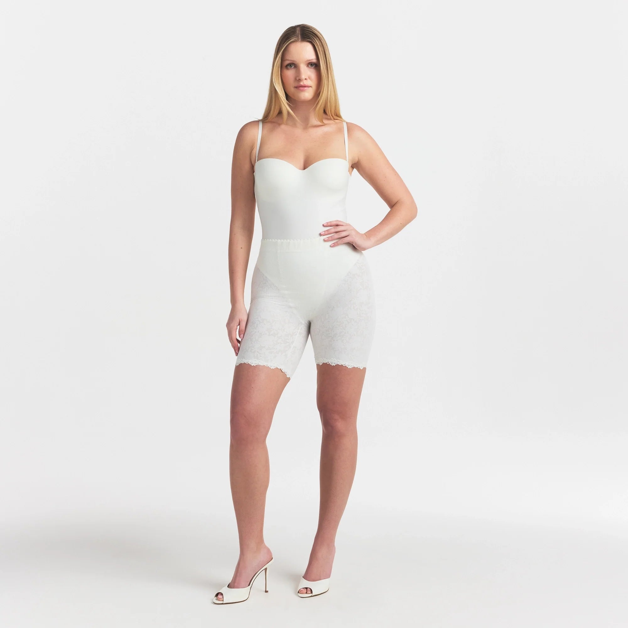 SKIMS BODY UNDERWIRE THONG BODYSUIT | IVORY ON A MODEL FRONT VIEW @