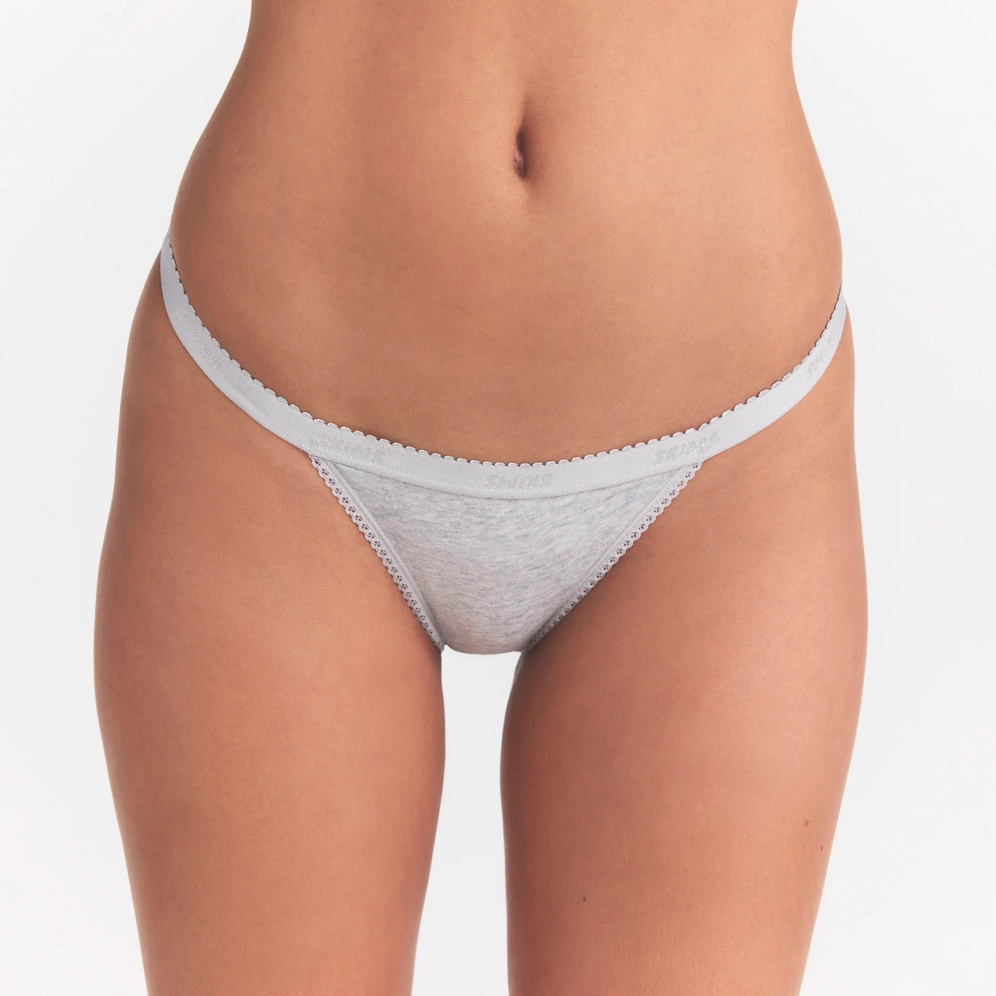 LIGHTWEIGHT COTTON LOGO PICOT STRING BIKINI | LIGHT HEATHER GREY ON A MODEL SIDE VIEW | FOCUS: 0.0, 1.0, 0.9