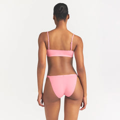 LIGHTWEIGHT COTTON LOGO PICOT STRING BIKINI | MELON TONAL ON A MODEL SIDE VIEW @ | FOCUS: 0.0, 1.0, 0.9