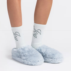 FAUX FUR SLIPPER | ZEN BLUE ON A MODEL FRONT VIEW @ | FOCUS: 0.0, 1.0, 0.9