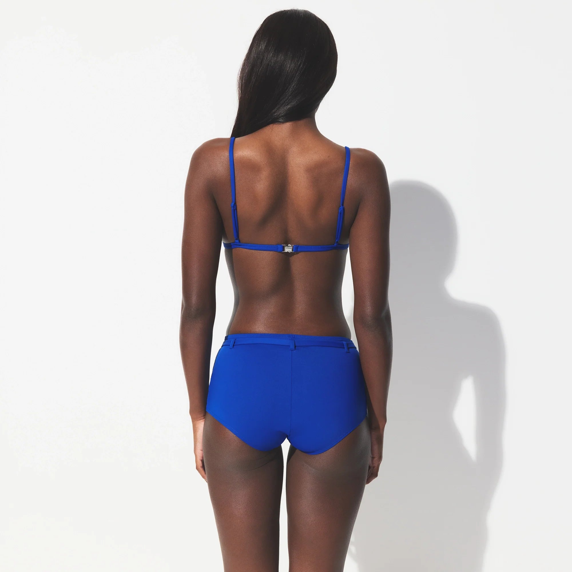 ICONIC SWIM BELTED BOY SHORT BIKINI BOTTOM | COBALT ON A MODEL SIDE VIEW @ | FOCUS: 0.0, 1.0, 0.9 