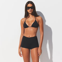 SIGNATURE SWIM SHORT BIKINI BOTTOM | ONYX ON A MODEL SIDE VIEW @ | FOCUS: 0.0, 1.0, 0.9 @ | FOCUS: 0.0, 1.0, 0.9 