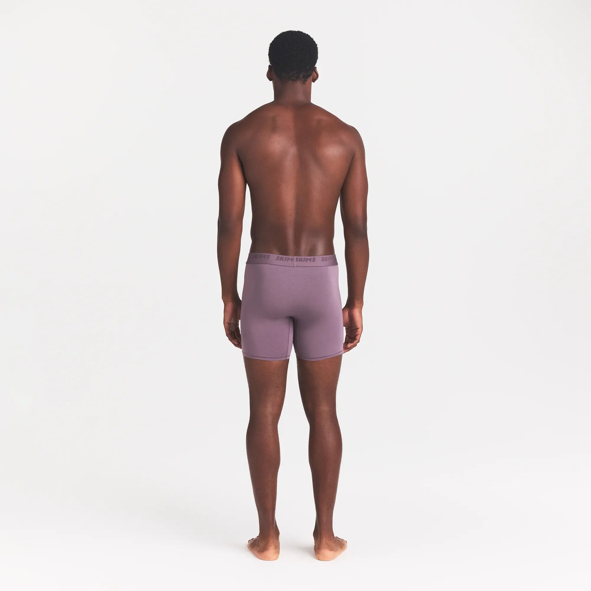 SKIMS STRETCH MENS 5" BOXER BRIEF | IRIS ON A MODEL BACK VIEW @ | FOCUS: 0.0, 1.0, 0.9
