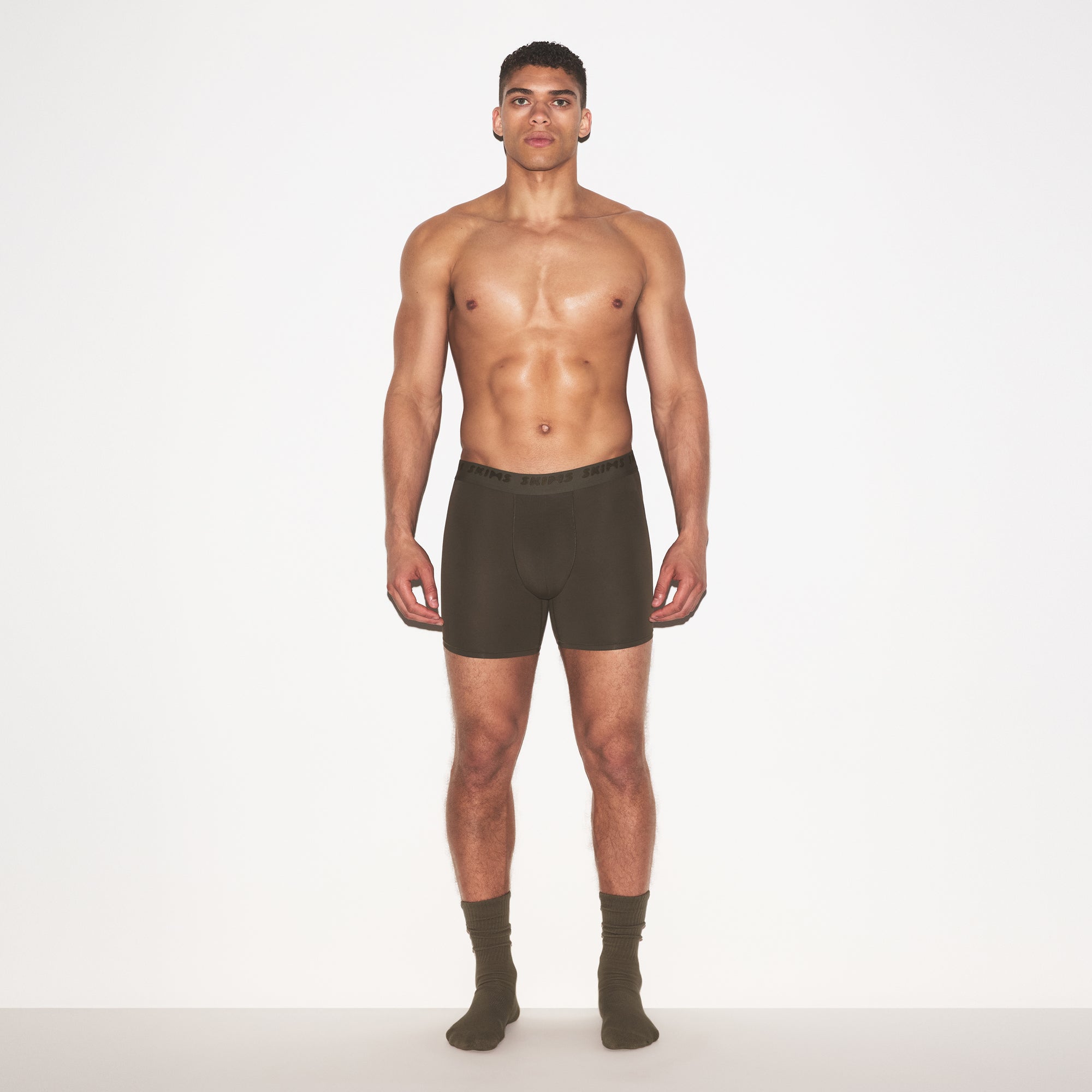 SKIMS STRETCH MENS 5" BOXER BRIEF | LODEN ON A MODEL FRONT VIEW @ | FOCUS: 0.0, 1.0, 0.9