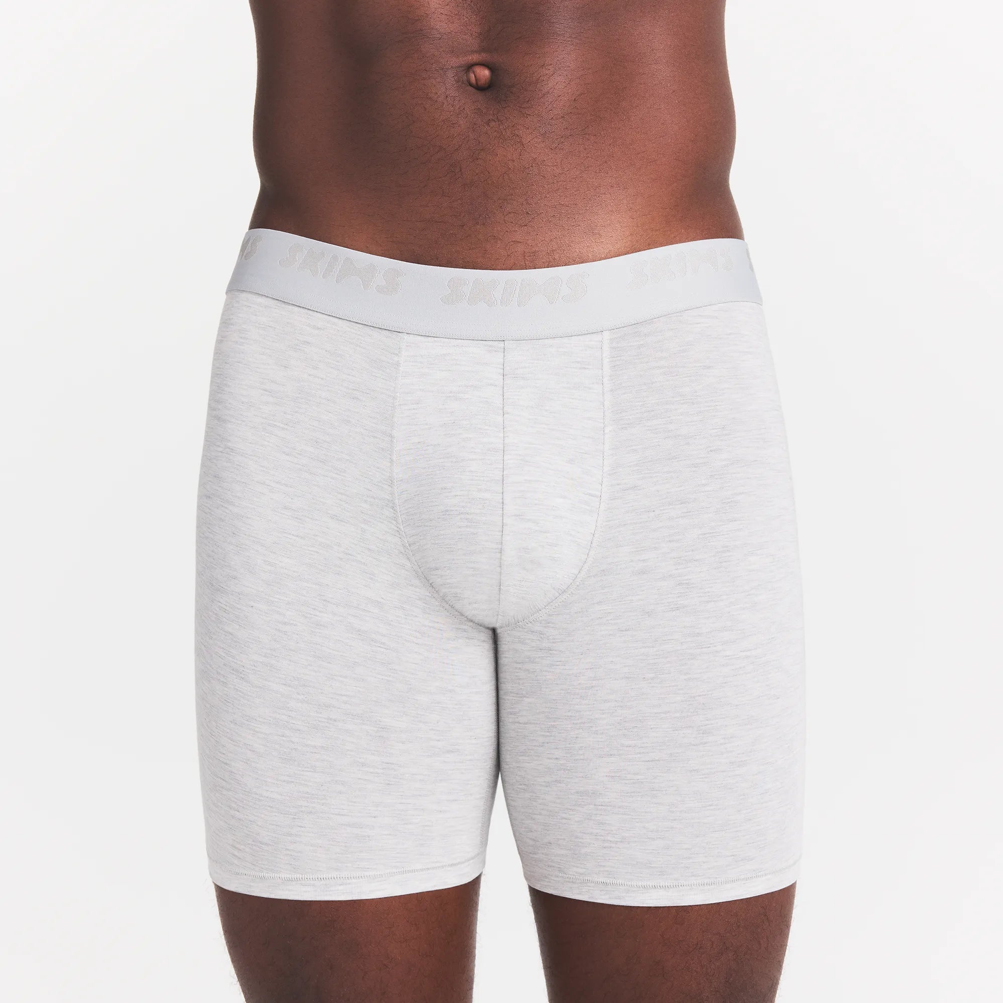 SKIMS STRETCH MENS 5" BOXER BRIEF | LIGHT HEATHER GREY ON A MODEL FRONT VIEW @ | FOCUS: 0.0, 1.0, 0.9