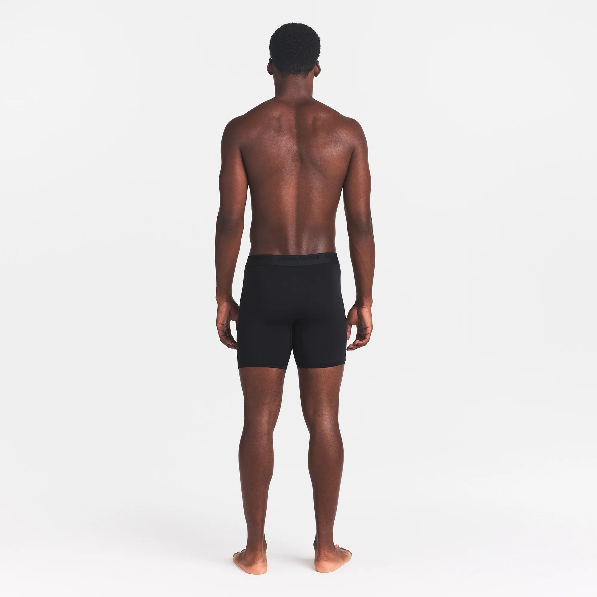 SKIMS STRETCH MENS 5" BOXER BRIEF | OBSIDIAN ON A MODEL BACK VIEW