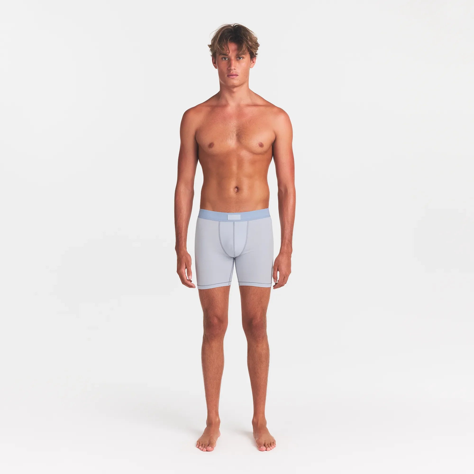SKIMS COTTON MENS 5" BOXER BRIEF | ATMOSPHERE ON A MODEL FRONT VIEW @ | FOCUS: 0.0, 1.0, 0.9