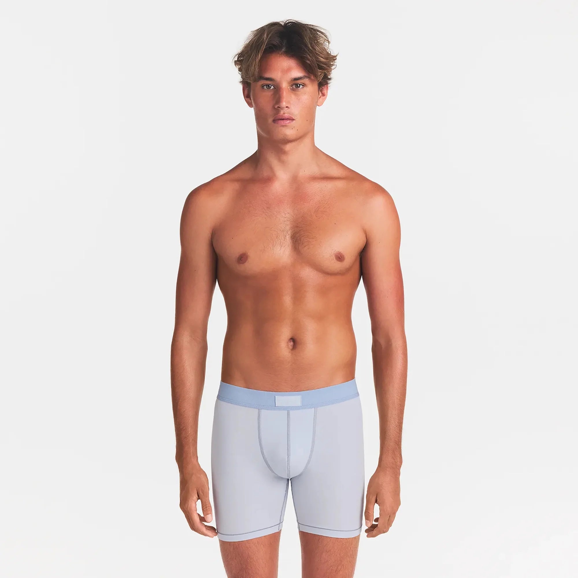 SKIMS COTTON MENS 5" BOXER BRIEF | ATMOSPHERE ON A MODEL FRONT VIEW
