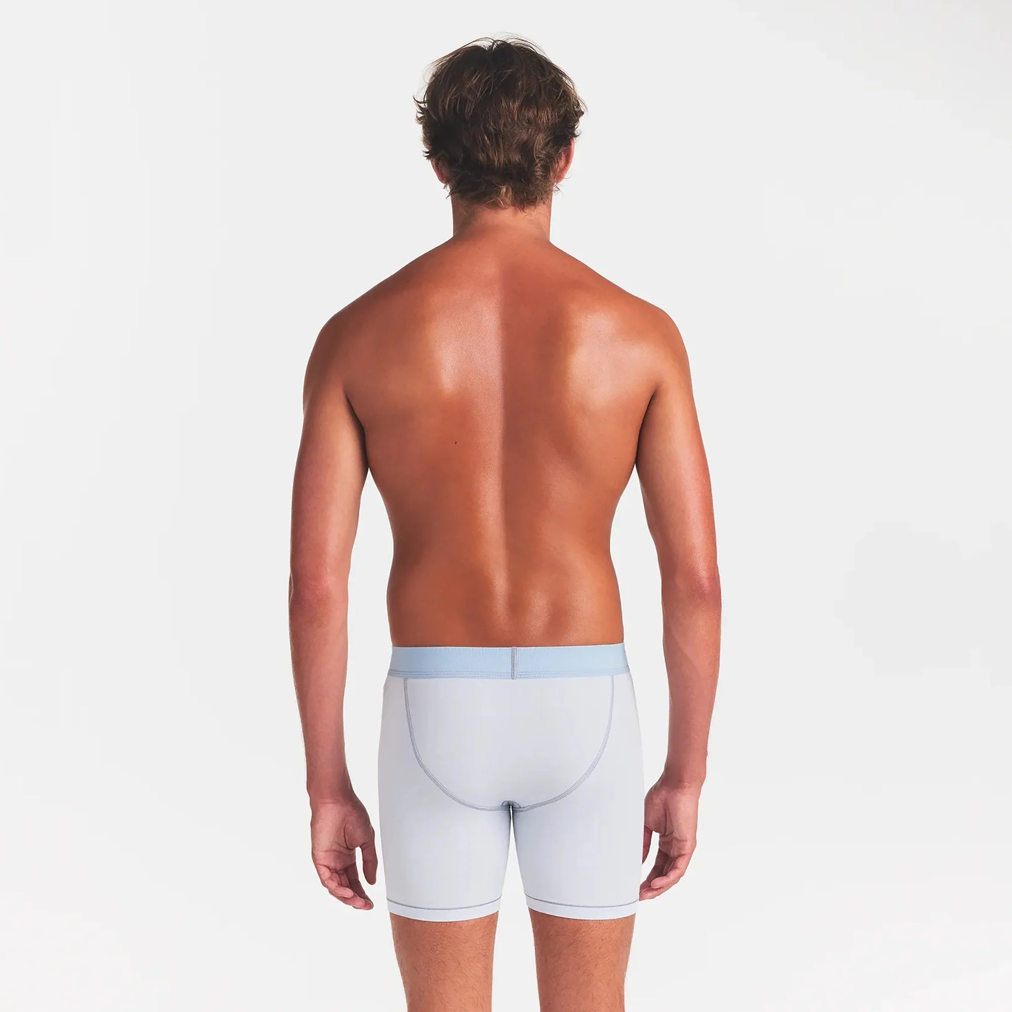 SKIMS COTTON MENS 5" BOXER BRIEF | ATMOSPHERE ON A MODEL BACK VIEW