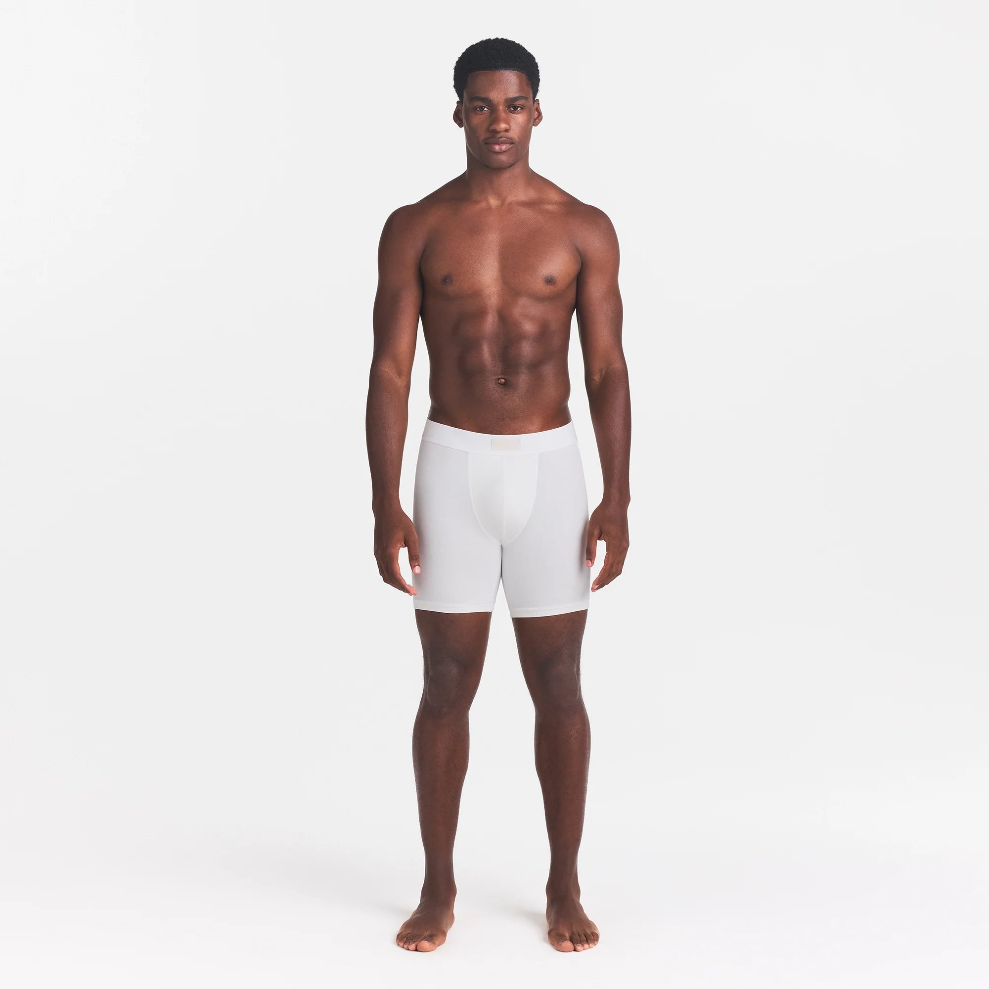 SKIMS COTTON MENS 5" BOXER BRIEF | CHALK ON A MODEL FRONT VIEW @ | FOCUS: 0.0, 1.0, 0.9