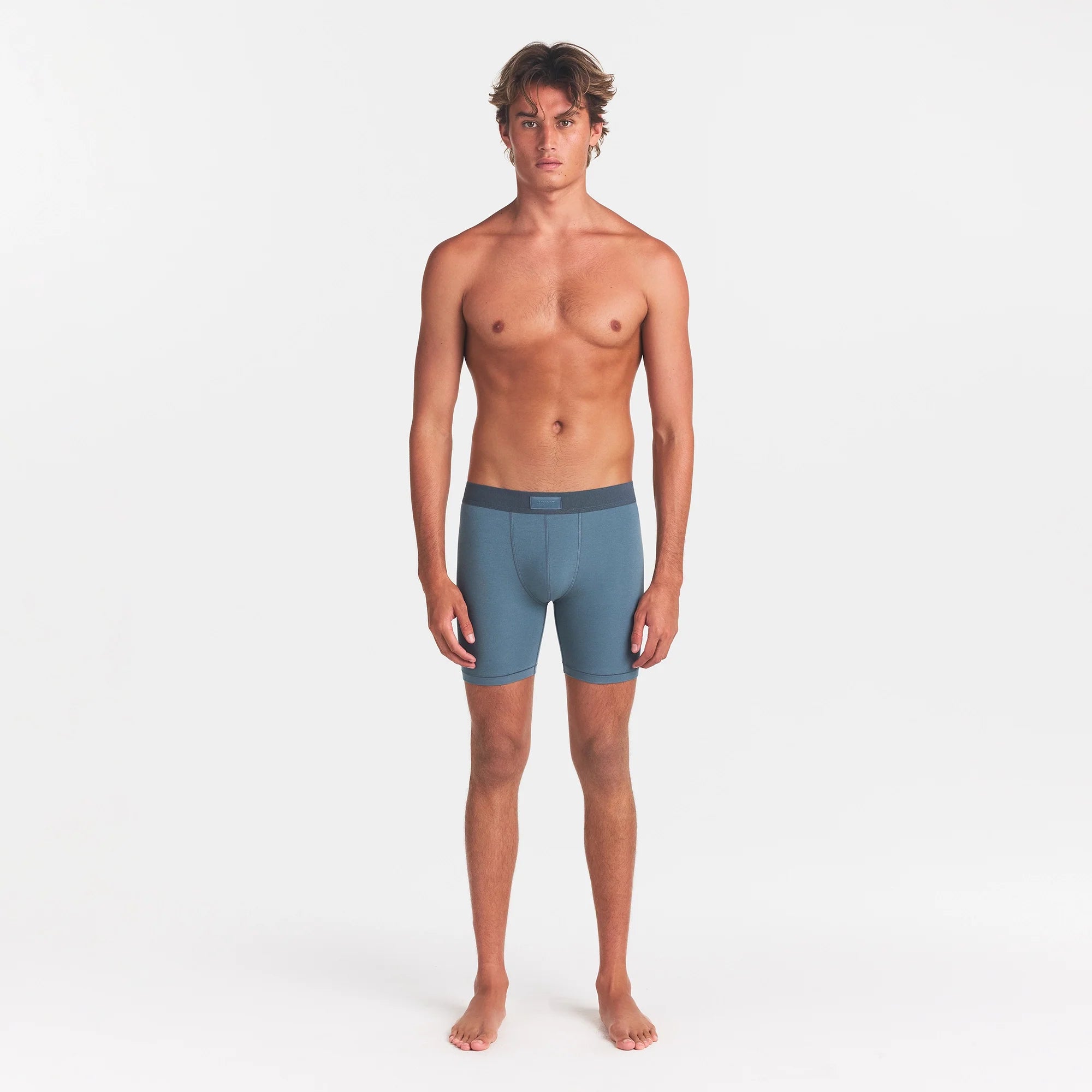 SKIMS COTTON MENS 5" BOXER BRIEF | KYANITE ON A MODEL FRONT VIEW @ | FOCUS: 0.0, 1.0, 0.9