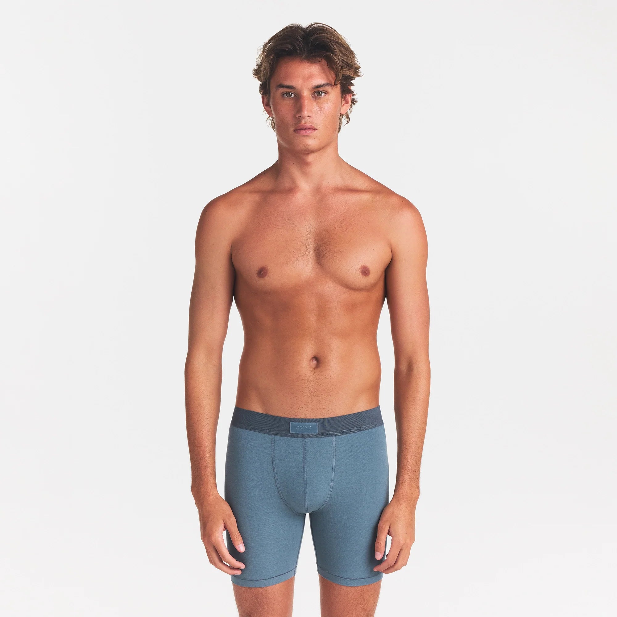 SKIMS COTTON MENS 5" BOXER BRIEF | KYANITE ON A MODEL FRONT VIEW