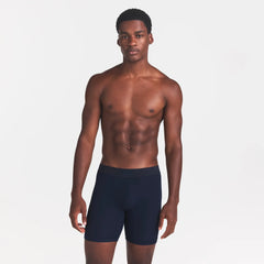 SKIMS COTTON MENS 5" BOXER BRIEF | NAVY ON A MODEL FRONT VIEW