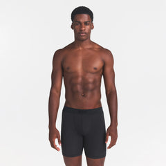SKIMS COTTON MENS 5" BOXER BRIEF | ONYX ON A MODEL FRONT VIEW