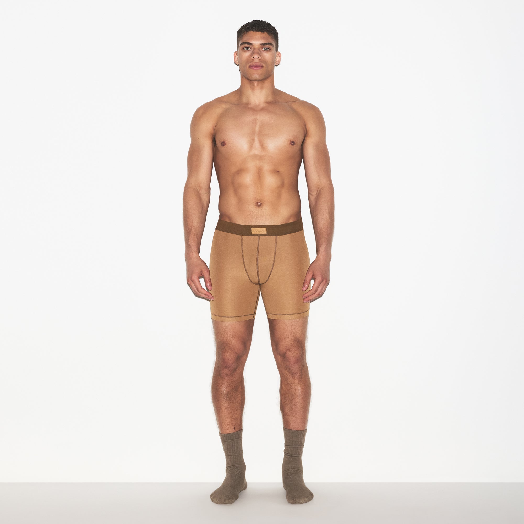 SKIMS COTTON MENS 5 INCH BOXER BRIEF | RUSSET ON A MODEL FRONT VIEW | FOCUS: 0.0, 1.0, 0.9