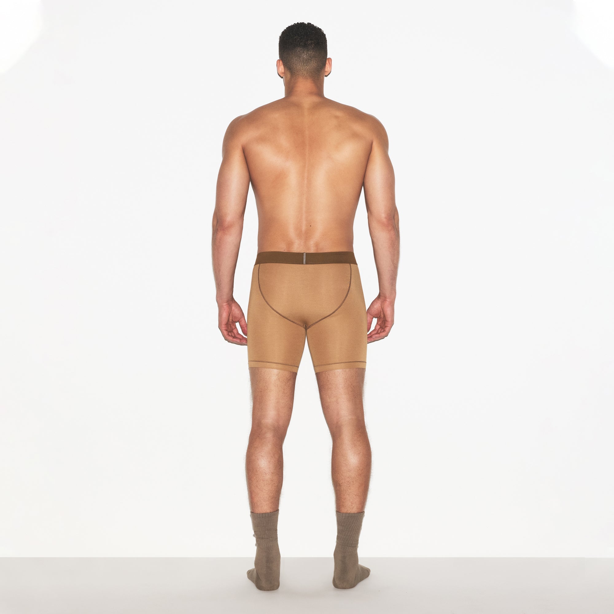 SKIMS COTTON MENS 5 INCH BOXER BRIEF | RUSSET ON A MODEL FRONT VIEW | FOCUS: 0.0, 1.0, 0.9