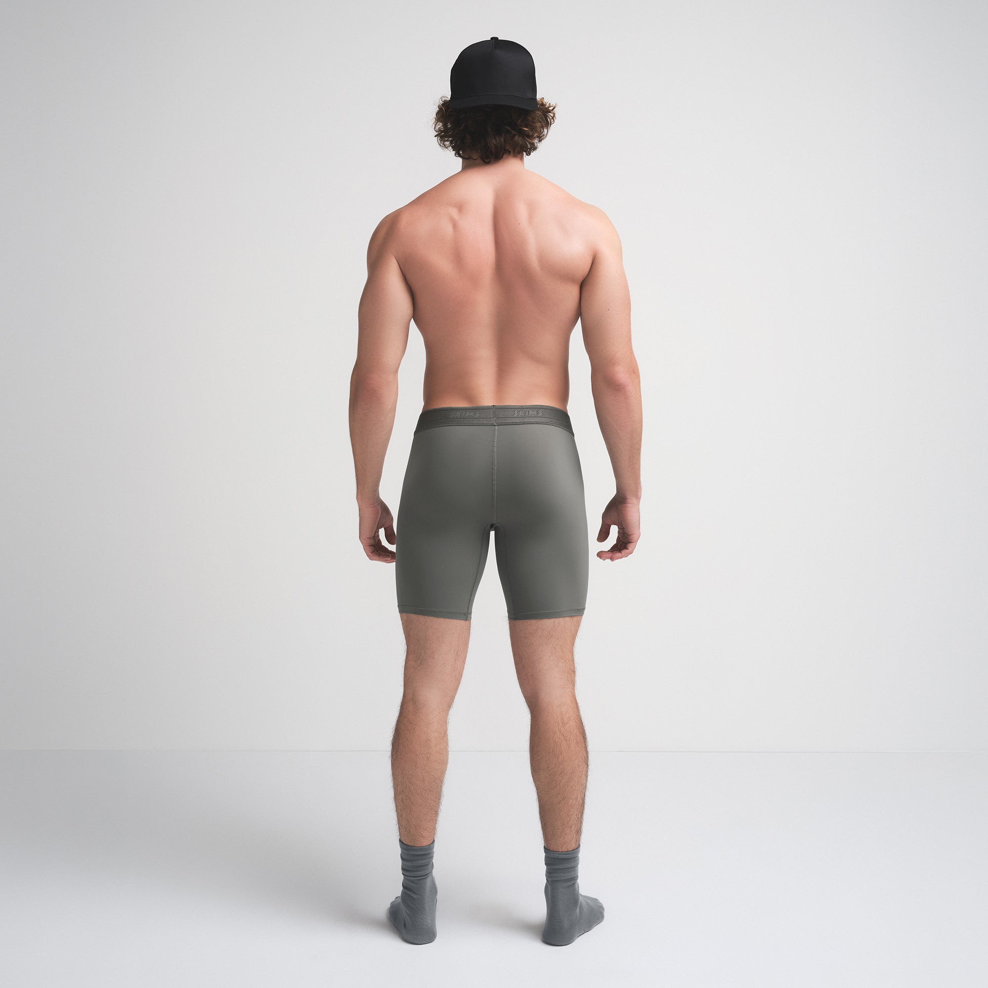 SKIMS SPORT MENS 7" BOXER BRIEF | GUNMETAL ON A MODEL SIDE VIEW | FOCUS: 0.0, 1.0, 0.9