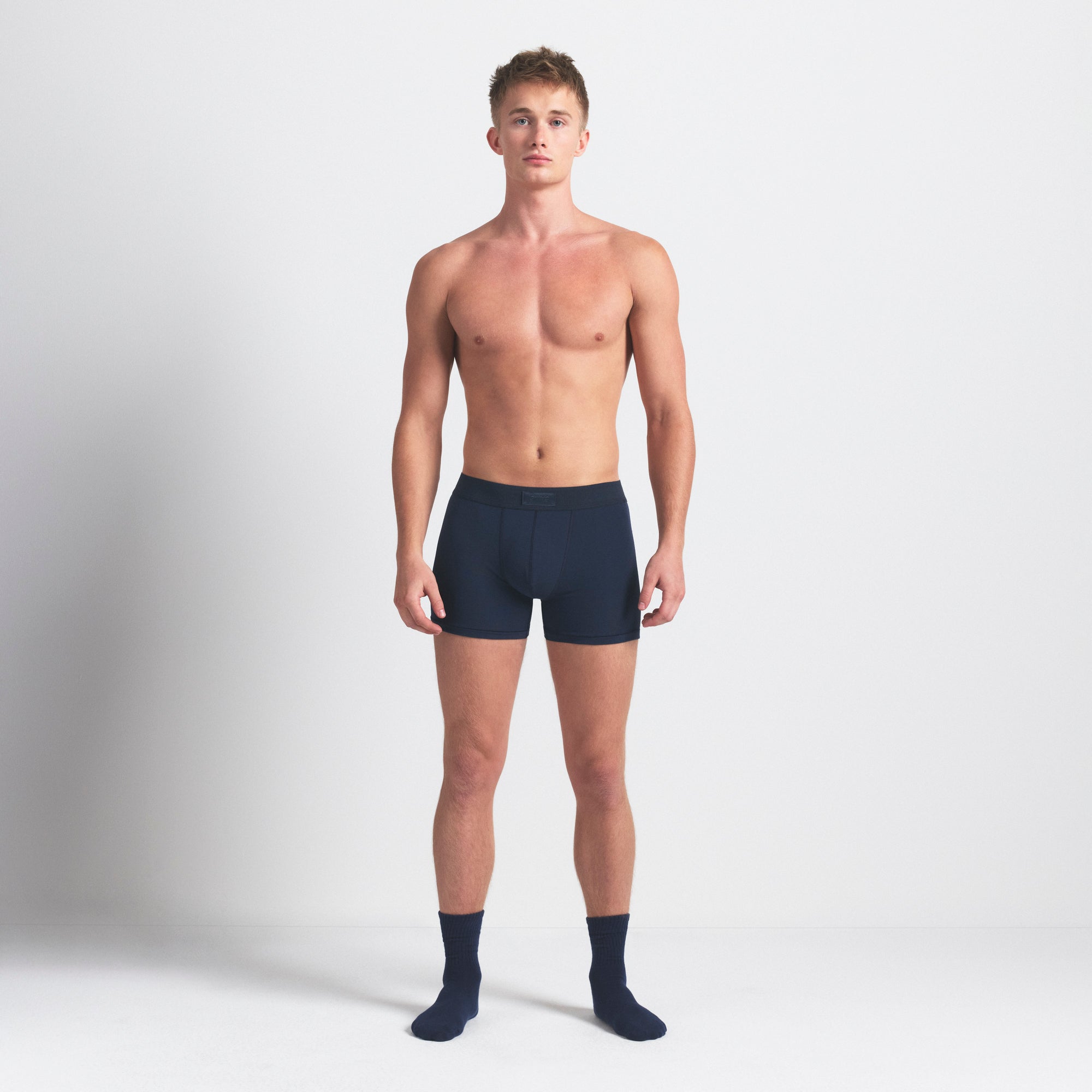 SKIMS COTTON MENS 3" BOXER BRIEF 3-PACK | BLUE BLACK MULTI ON A MODEL FRONT VIEW @ | FOCUS: 0.0, 1.0, 0.9