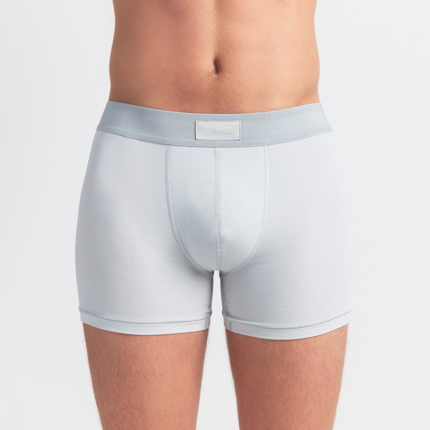 SKIMS COTTON MENS 3" BOXER BRIEF 3-PACK | BLUE BLACK MULTI ON A MODEL SIDE VIEW @ | FOCUS: 0.0, 1.0, 0.9