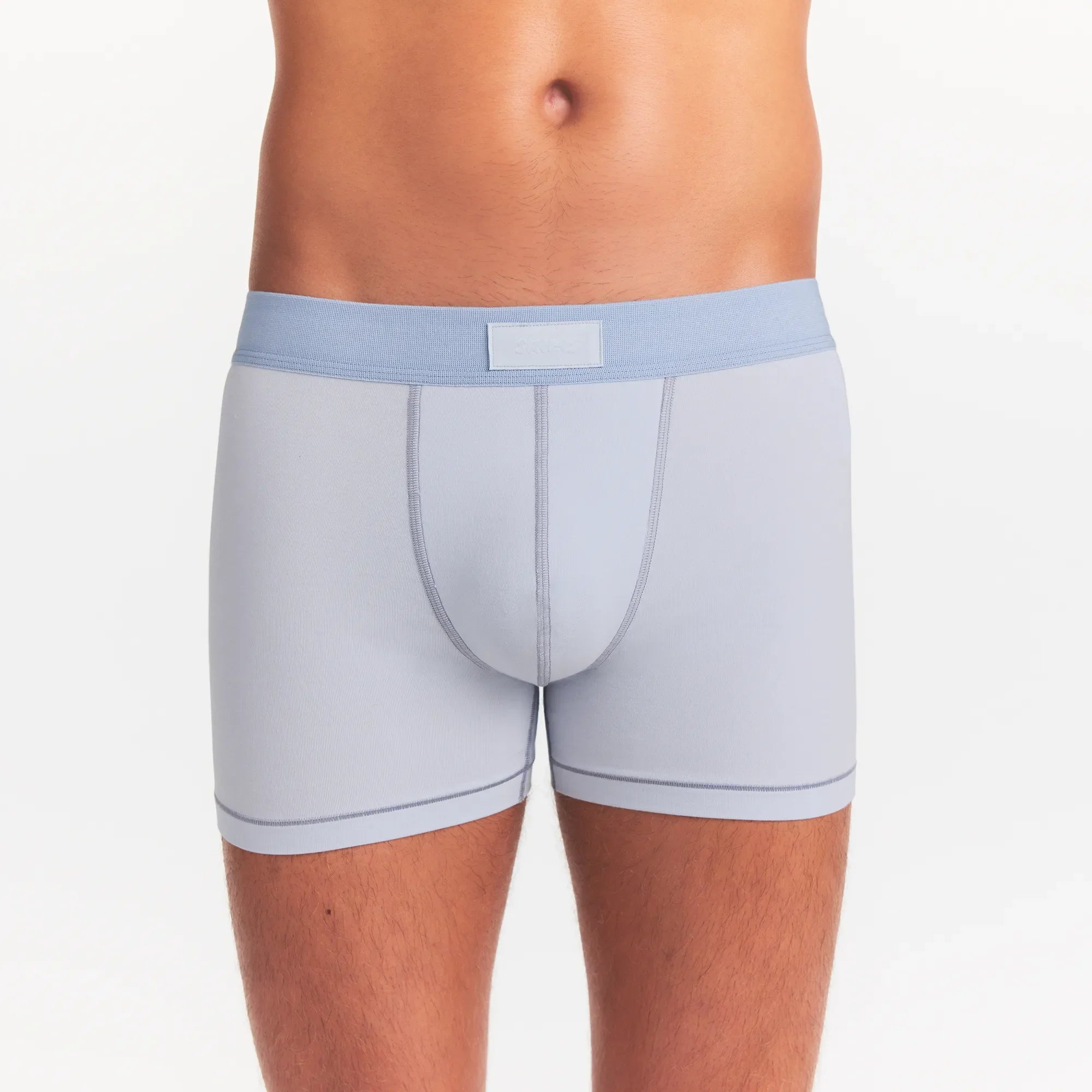 SKIMS COTTON MENS 3" BOXER BRIEF 3-PACK | NIMBUS MULTI ON A MODEL FRONT VIEW