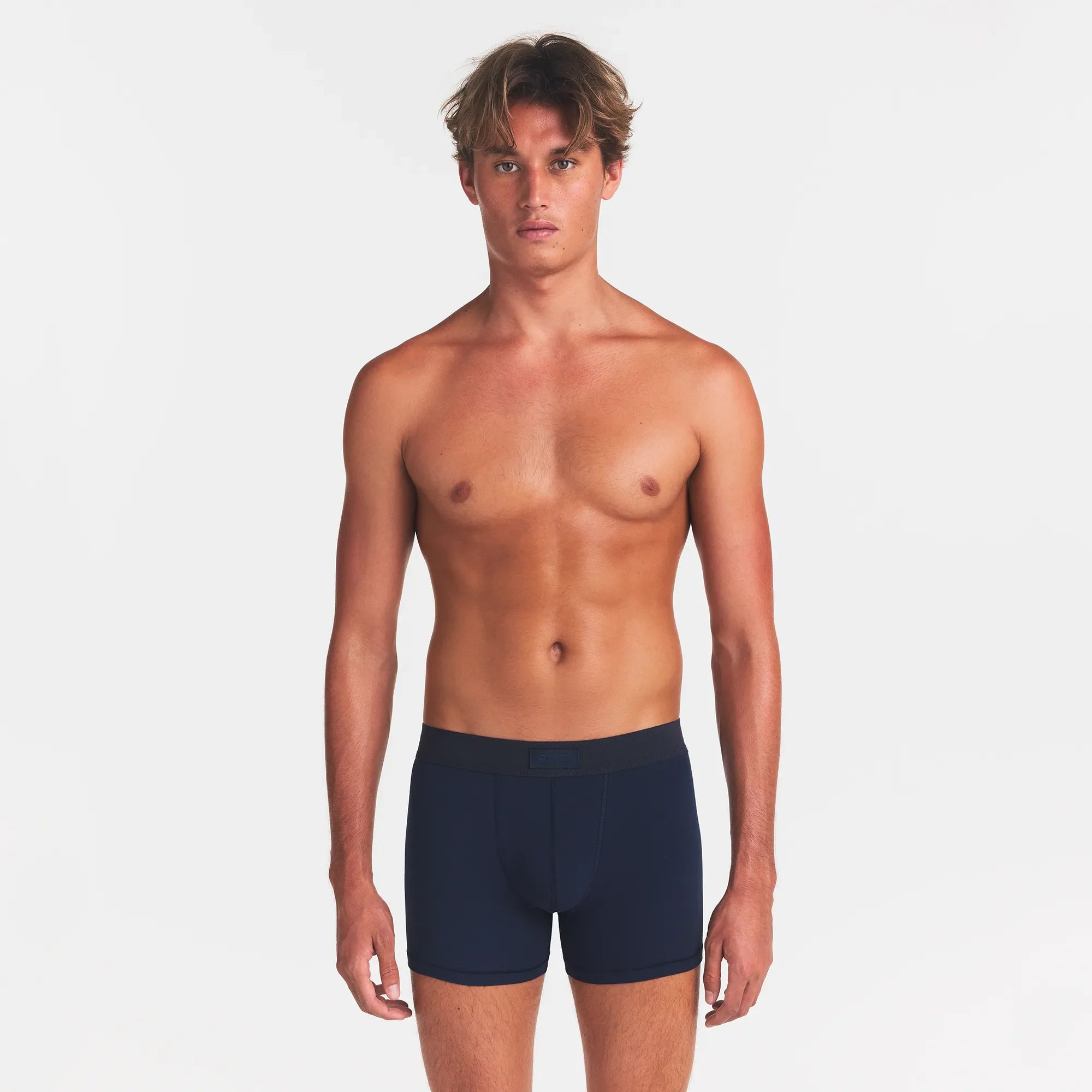SKIMS COTTON MENS 3" BOXER BRIEF 3-PACK | NIMBUS MULTI ON A MODEL FRONT VIEW