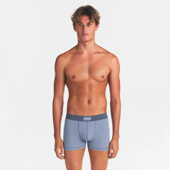 SKIMS COTTON MENS 3" BOXER BRIEF 3-PACK | NIMBUS MULTI ON A MODEL FRONT VIEW