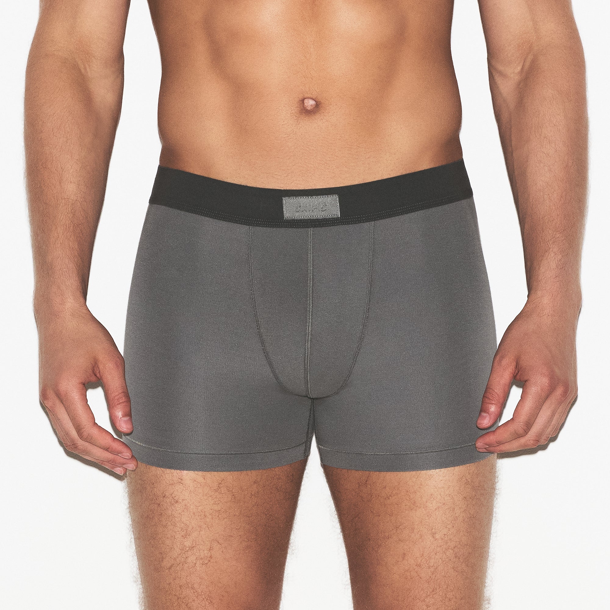 SKIMS COTTON MENS 3 INCH BOXER BRIEF 3-PACK | RUSSET MULTI ON A MODEL SIDE VIEW | FOCUS: 0.0, 1.0, 0.9