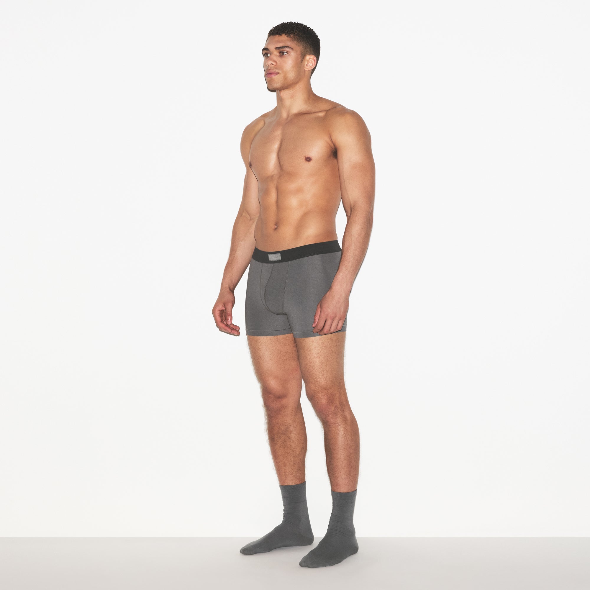 SKIMS COTTON MENS 3 INCH BOXER BRIEF 3-PACK | RUSSET MULTI ON A MODEL FRONT VIEW | FOCUS: 0.0, 1.0, 0.9