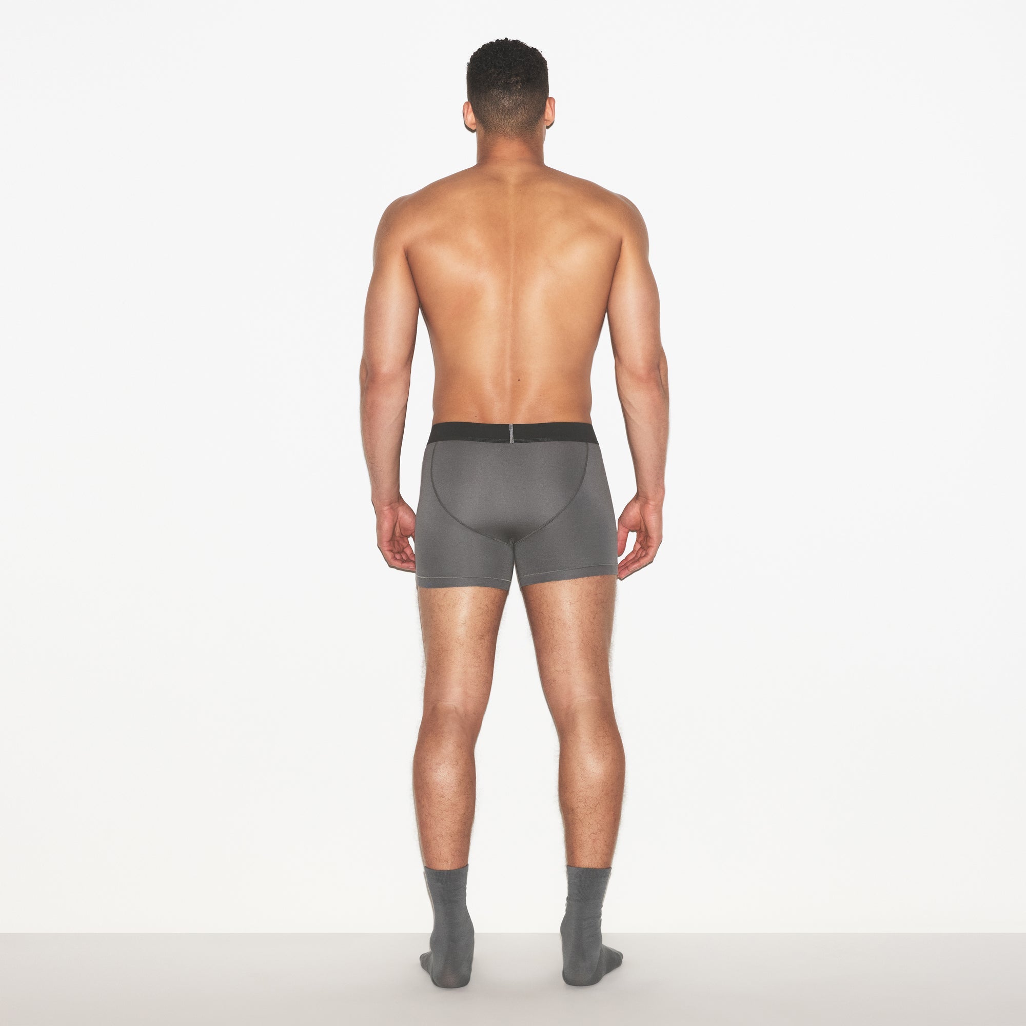 SKIMS COTTON MENS 3 INCH BOXER BRIEF 3-PACK | RUSSET MULTI ON A MODEL FRONT VIEW | FOCUS: 0.0, 1.0, 0.9