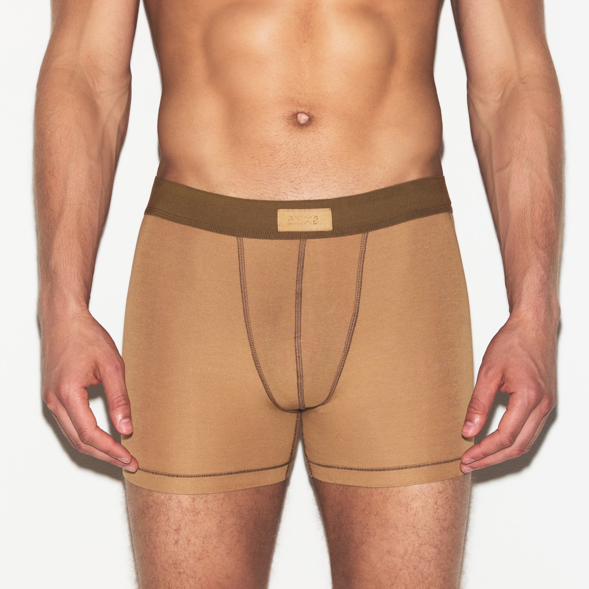SKIMS COTTON MENS 3 INCH BOXER BRIEF 3-PACK | RUSSET MULTI ON A MODEL SIDE VIEW | FOCUS: 0.0, 1.0, 0.9
