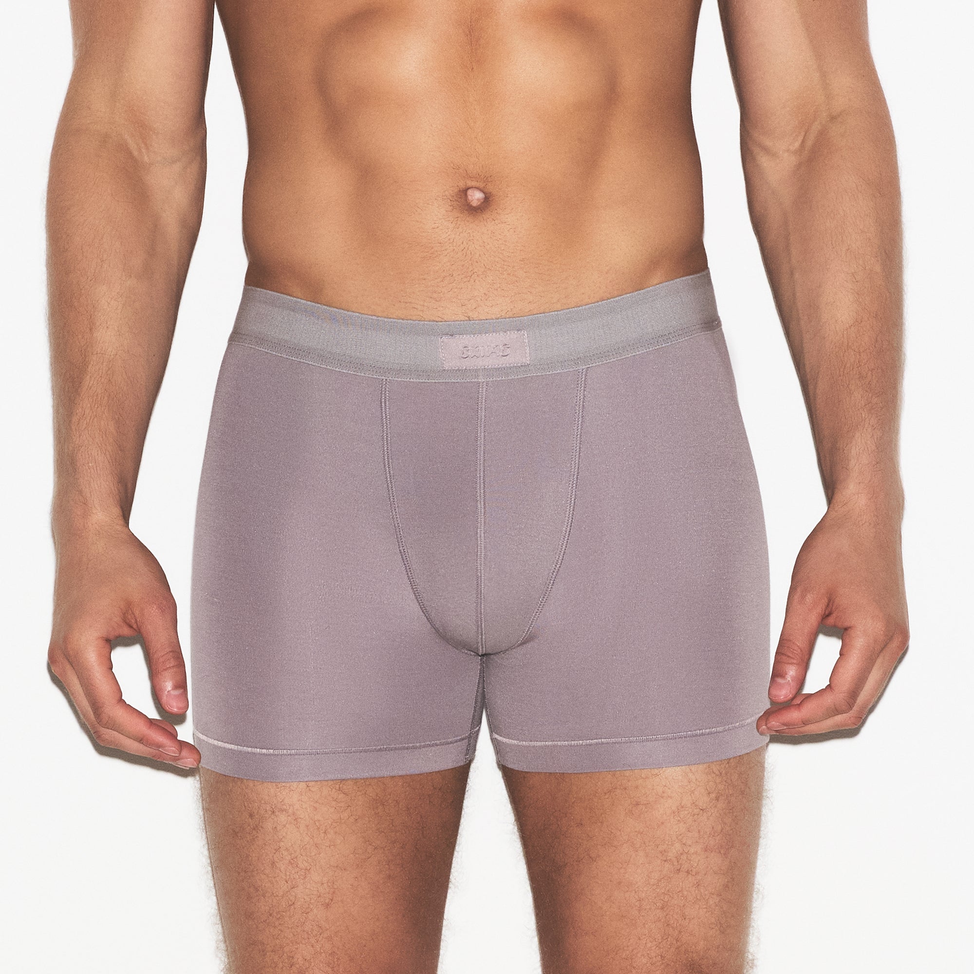 SKIMS COTTON MENS 3 INCH BOXER BRIEF 3-PACK | RUSSET MULTI ON A MODEL SIDE VIEW | FOCUS: 0.0, 1.0, 0.9