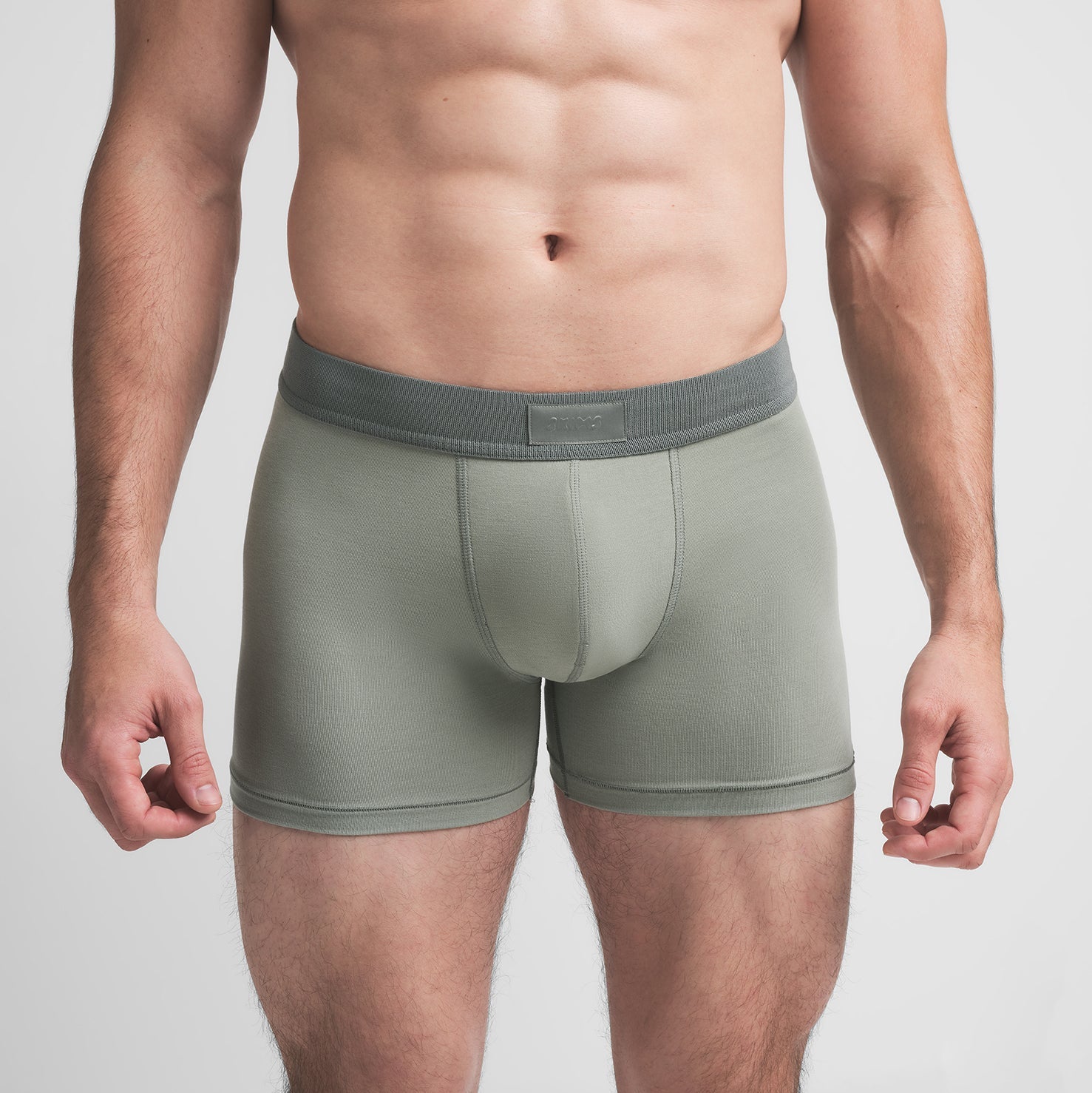 SKIMS COTTON MENS 3" BOXER BRIEF 3-PACK | STONE MULTI ON A MODEL FRONT VIEW @ | FOCUS: 0.9, 0.1, 0.7