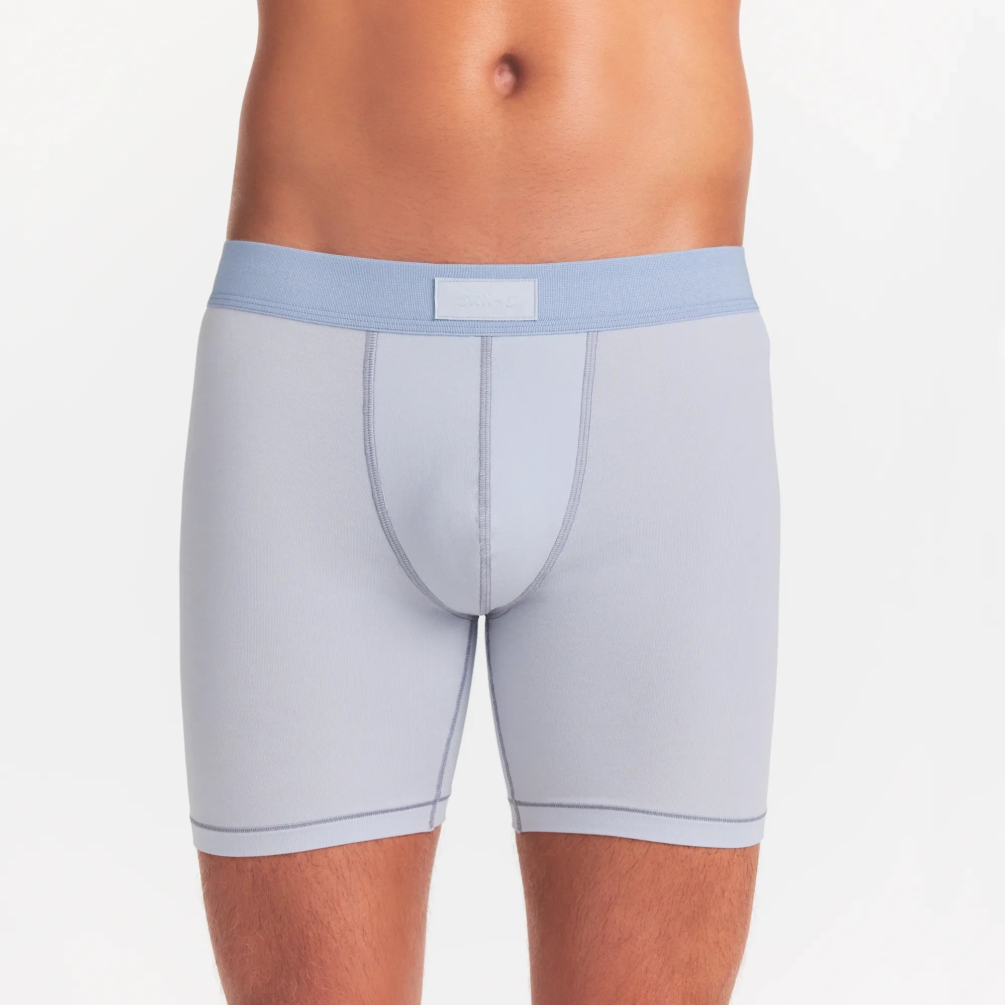 SKIMS COTTON MENS 5" BOXER BRIEF 3-PACK | NIMBUS MULTI ON A MODEL FRONT VIEW