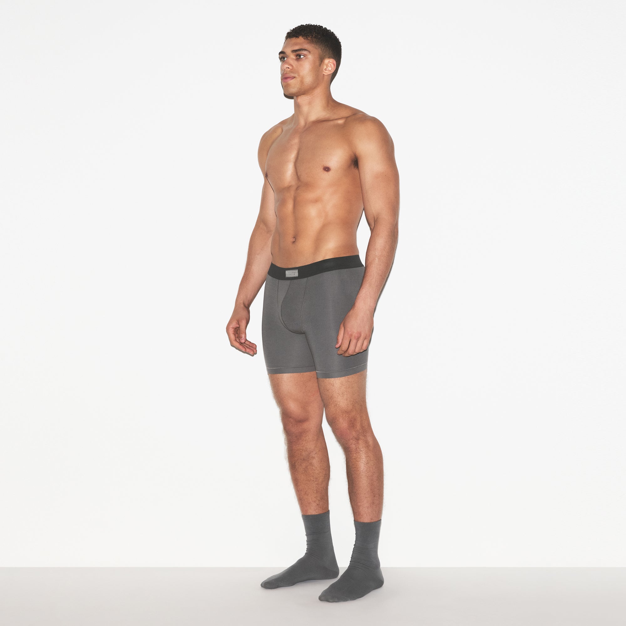 SKIMS COTTON MENS 5 INCH BOXER BRIEF 3-PACK | RUSSET MULTI ON A MODEL FRONT VIEW | FOCUS: 0.0, 1.0, 0.9