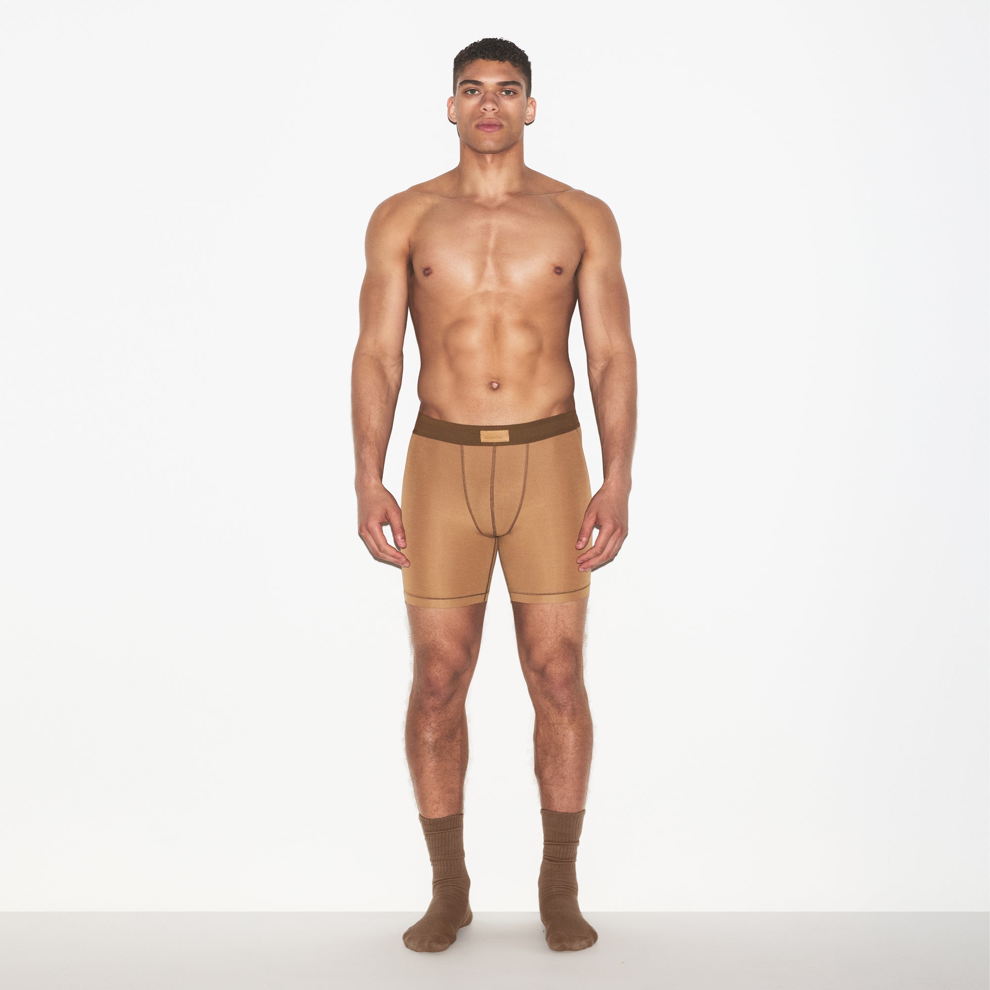 SKIMS COTTON MENS 5 INCH BOXER BRIEF 3-PACK | RUSSET MULTI ON A MODEL FRONT VIEW | FOCUS: 0.0, 1.0, 0.9