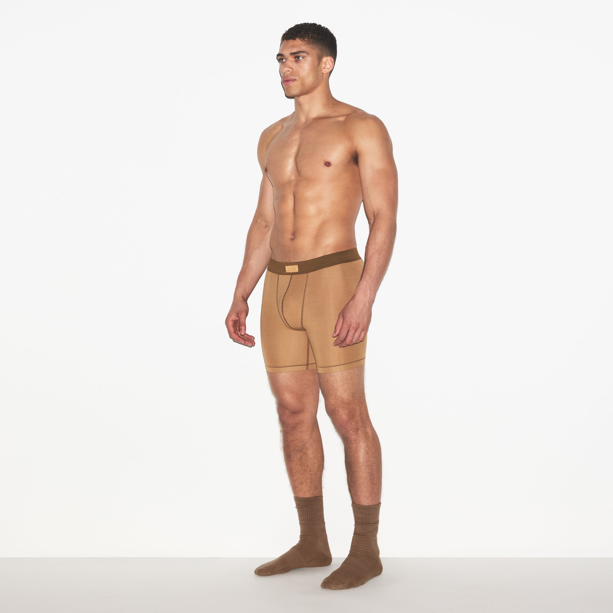 SKIMS COTTON MENS 5 INCH BOXER BRIEF 3-PACK | RUSSET MULTI ON A MODEL FRONT VIEW | FOCUS: 0.0, 1.0, 0.9
