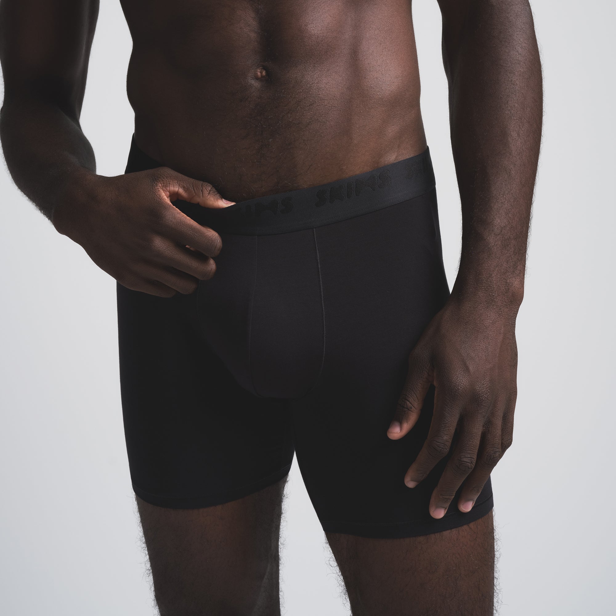 SKIMS STRETCH MENS 5" BOXER BRIEF 5-PACK | OBSIDIAN (MENS BOXERS) ON A MODEL FRONT VIEW