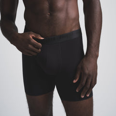 SKIMS STRETCH MENS 5" BOXER BRIEF 5-PACK | OBSIDIAN (MENS BOXERS) ON A MODEL FRONT VIEW