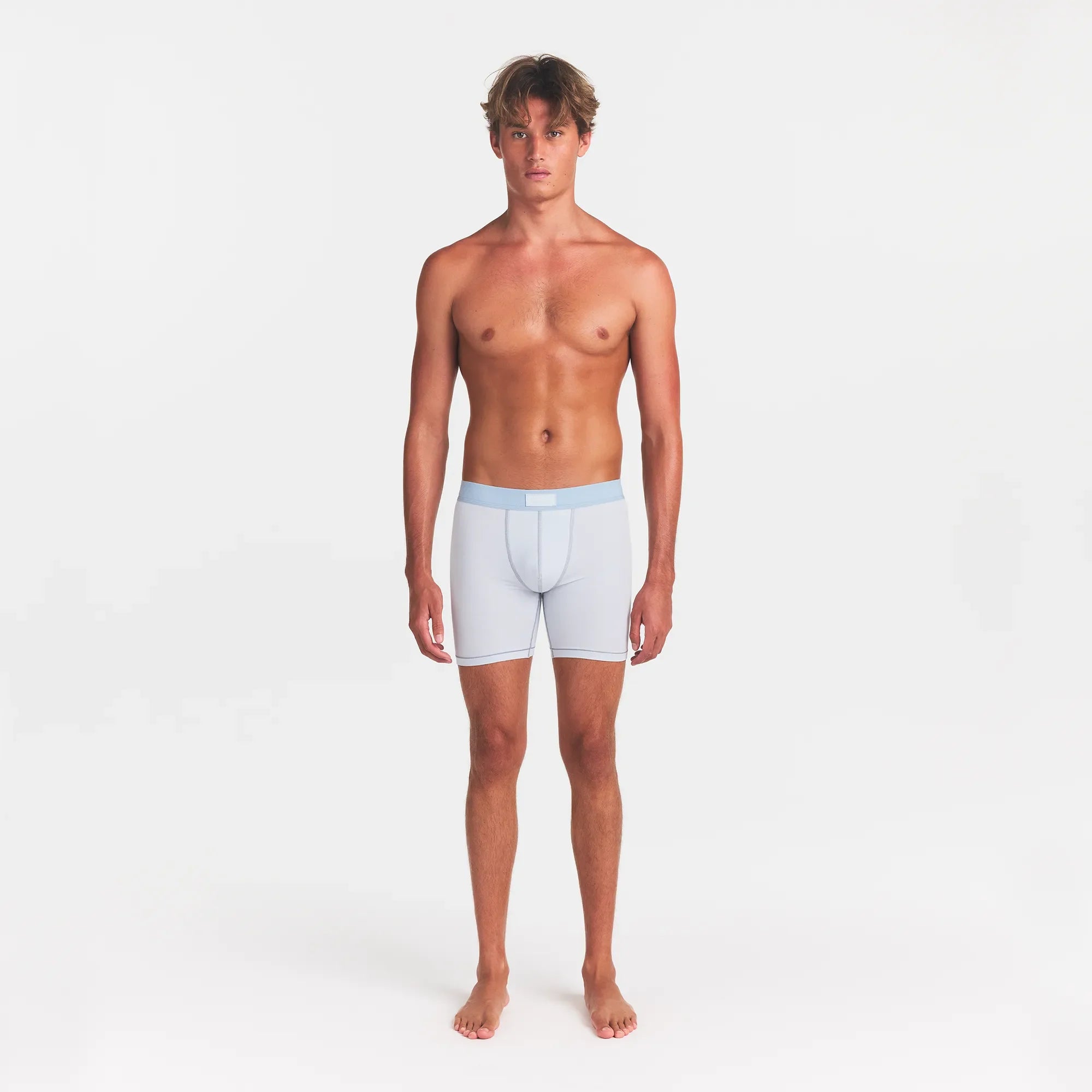 SKIMS COTTON MENS 5" BOXER BRIEF 5-PACK | ATMOSPHERE MULTI ON A MODEL FRONT VIEW @ | FOCUS: 0.0, 1.0, 0.9