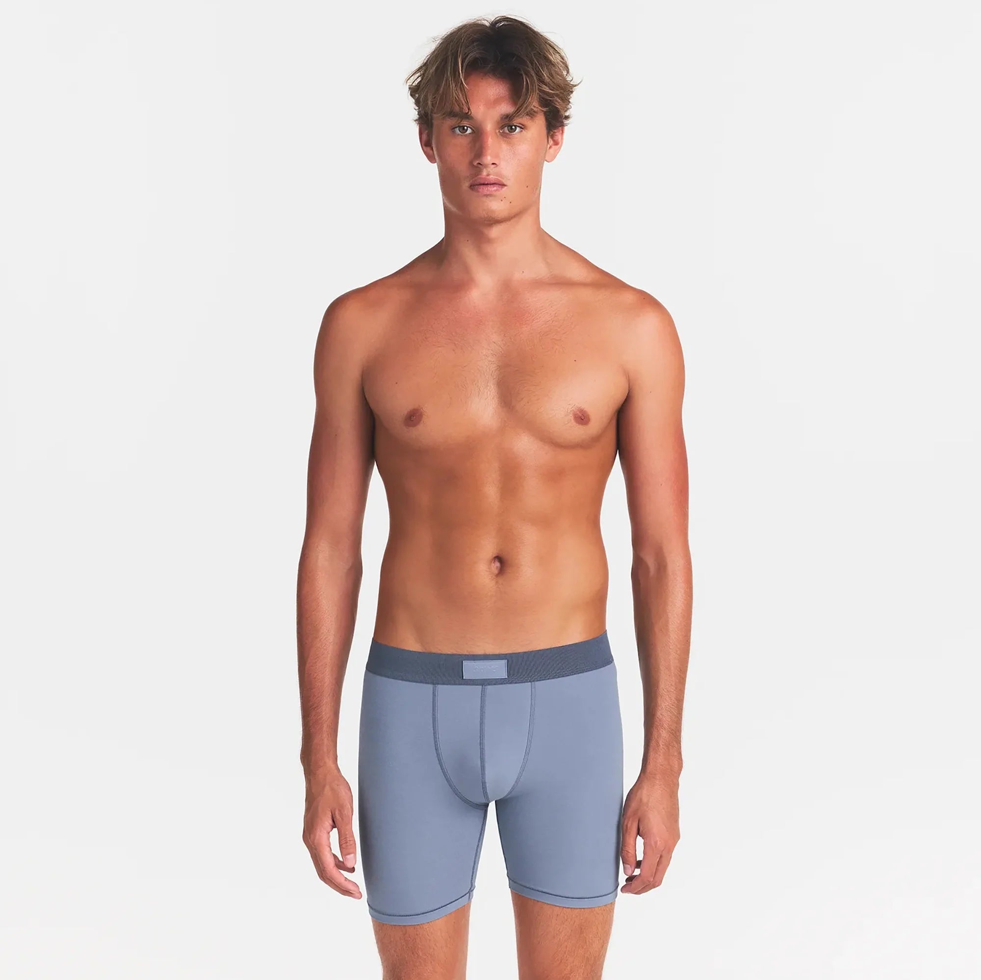 SKIMS COTTON MENS 5" BOXER BRIEF 5-PACK | ATMOSPHERE MULTI ON A MODEL FRONT VIEW