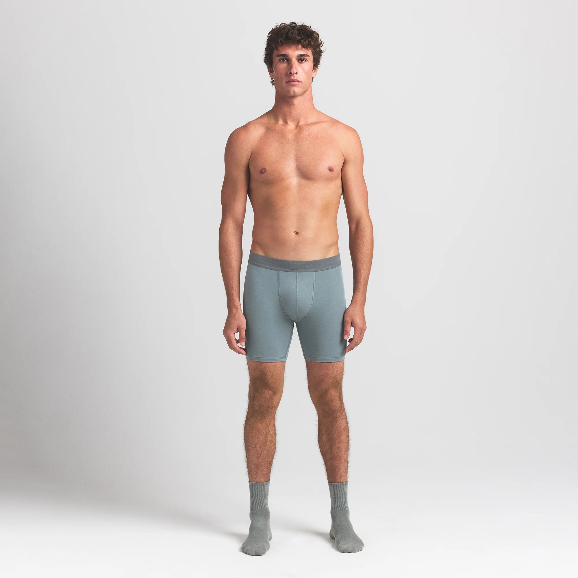 SKIMS COTTON MENS 5" BOXER BRIEF 5-PACK | VERDANT SKY MULTI ON A MODEL FRONT VIEW @ | FOCUS: 0.0, 1.0, 0.9