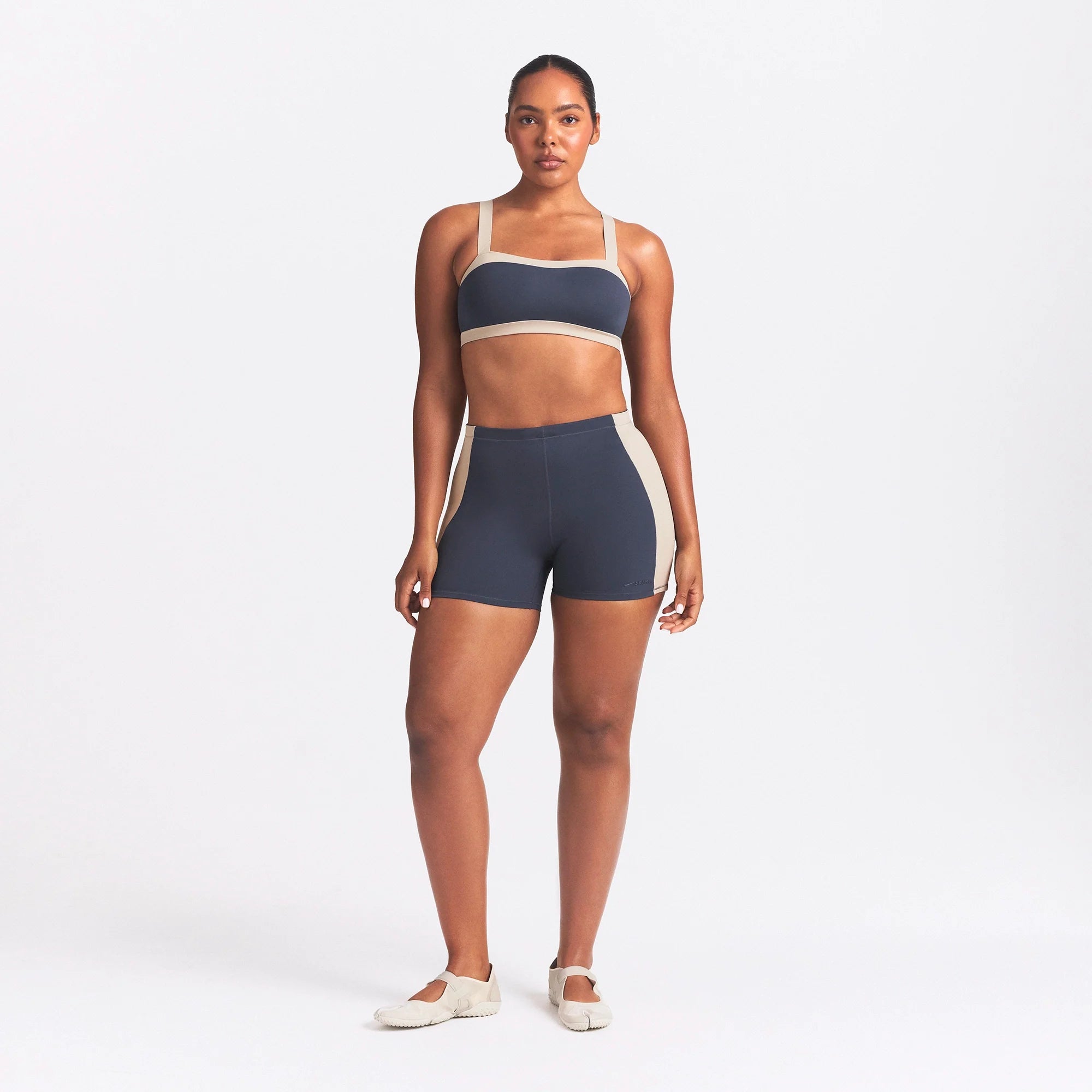 NikeSKIMS MATTE AND SHINE 5" BIKER SHORT | DEEP ROYAL/STONE ON A MODEL FRONT VIEW @ | FOCUS: 0.0, 1.0, 0.9