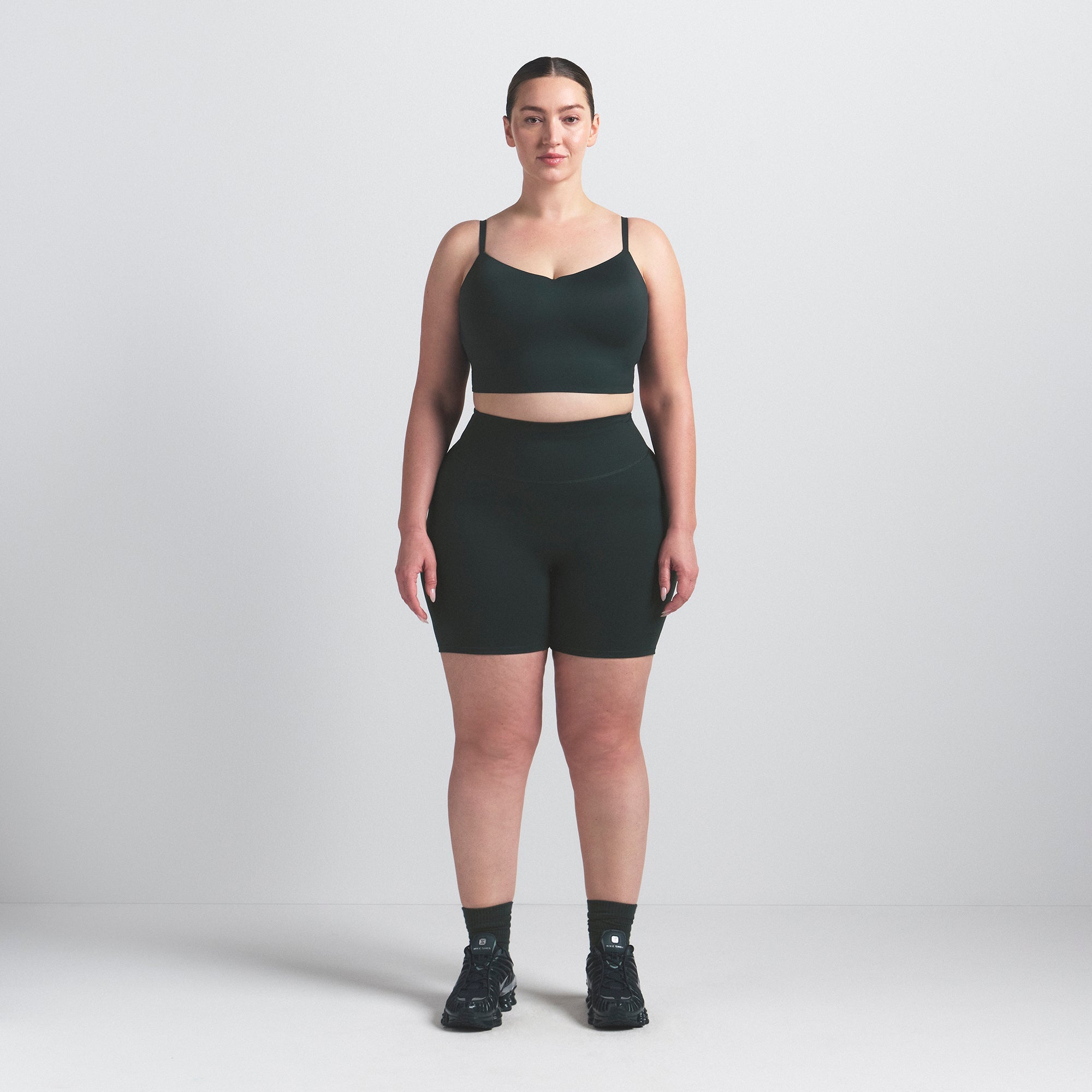 NikeSKIMS MATTE 5" BIKER SHORT | DARK TEAL ON A MODEL FRONT VIEW @ | FOCUS: 0.0, 1.0, 0.9