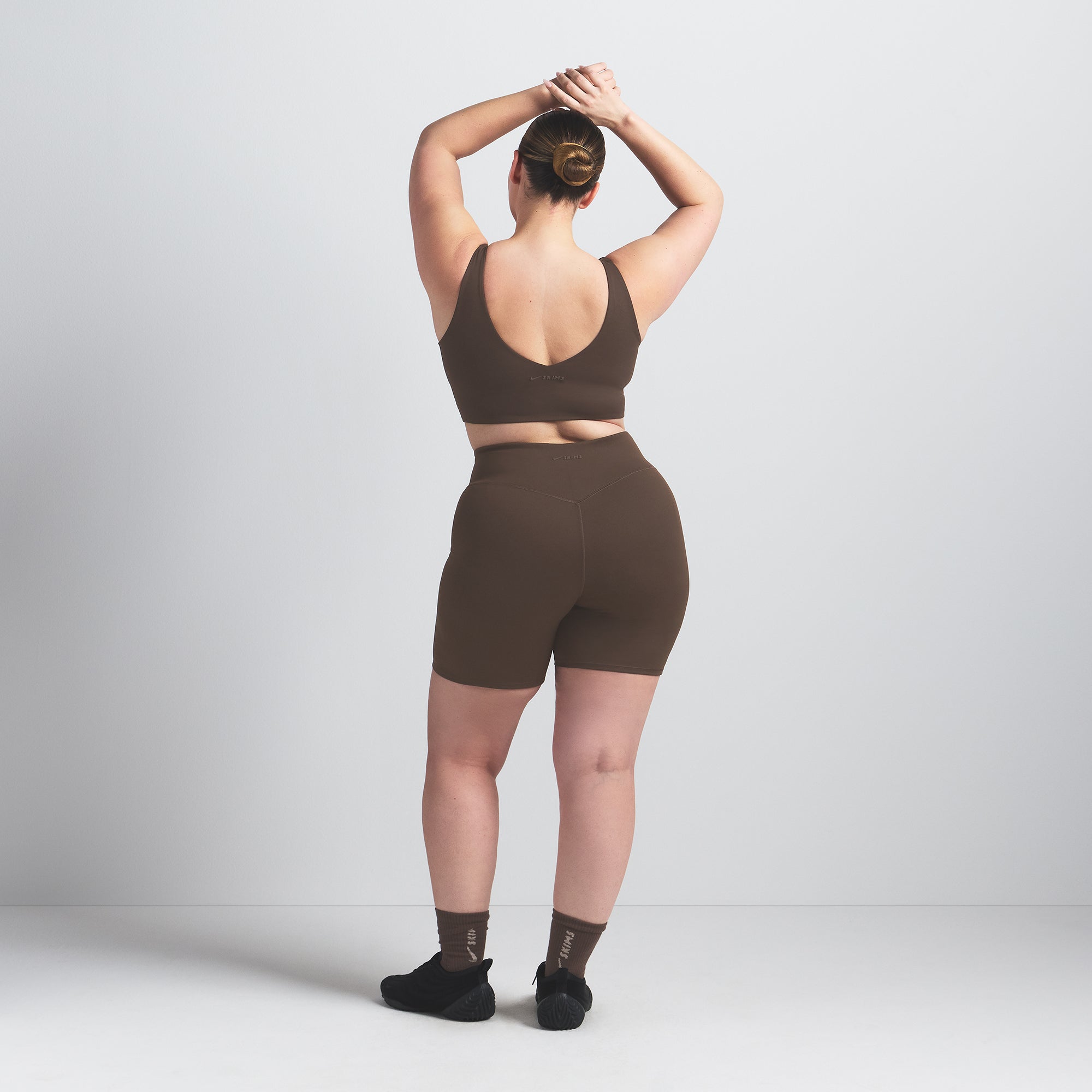 NikeSKIMS MATTE 5" BIKER SHORT | DARK SEPIA ON A MODEL BACK VIEW