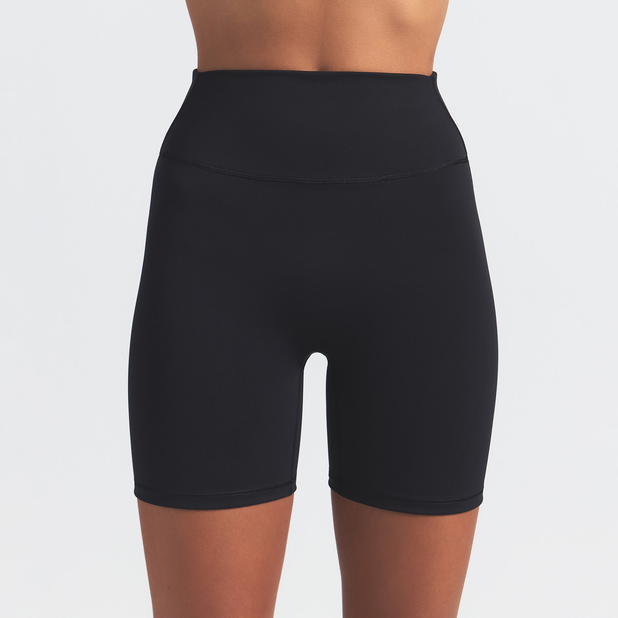 NikeSKIMS MATTE 5" BIKER SHORT | OBSIDIAN ON A MODEL FRONT VIEW