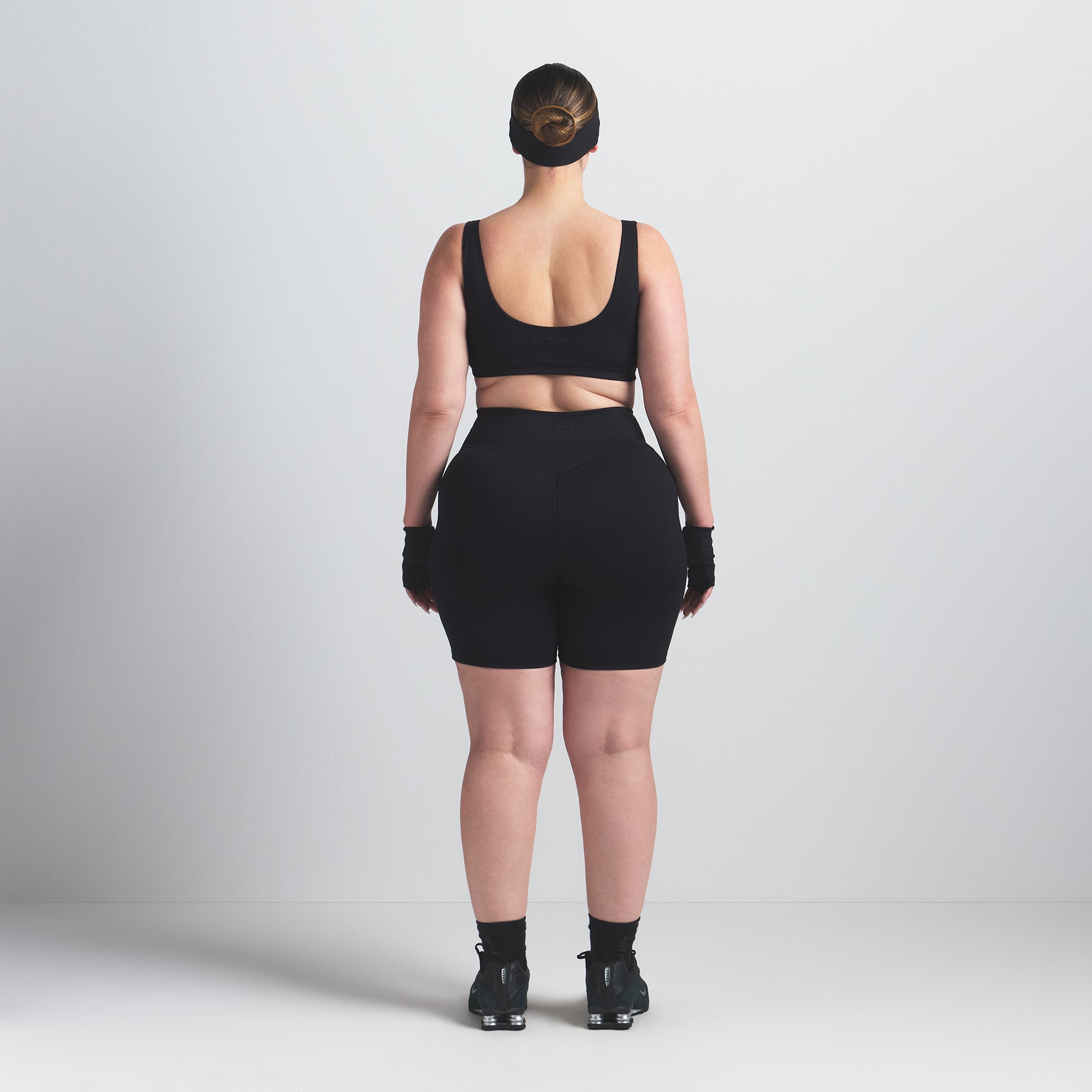 NikeSKIMS MATTE 5" BIKER SHORT | OBSIDIAN ON A MODEL BACK VIEW