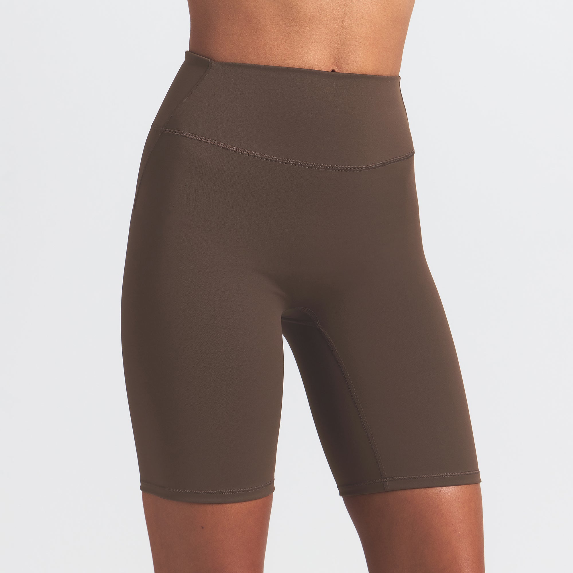 NikeSKIMS MATTE 7" BIKER SHORT | DARK SEPIA ON A MODEL FRONT VIEW
