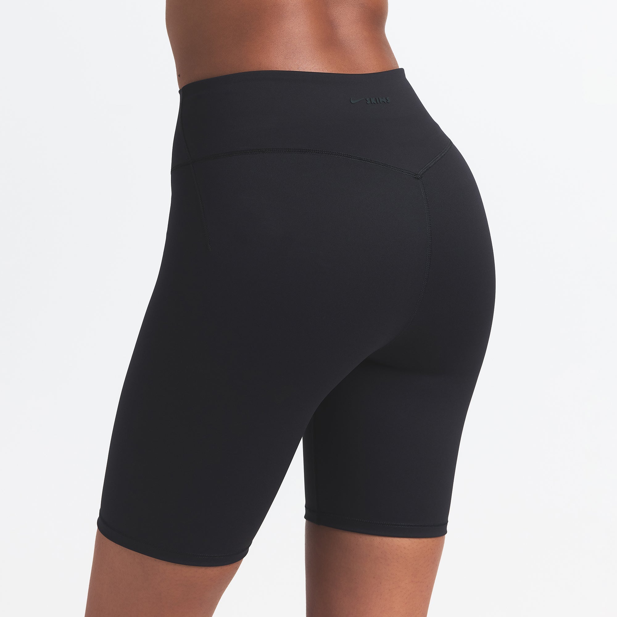 NikeSKIMS MATTE 7" BIKER SHORT | OBSIDIAN ON A MODEL BACK VIEW