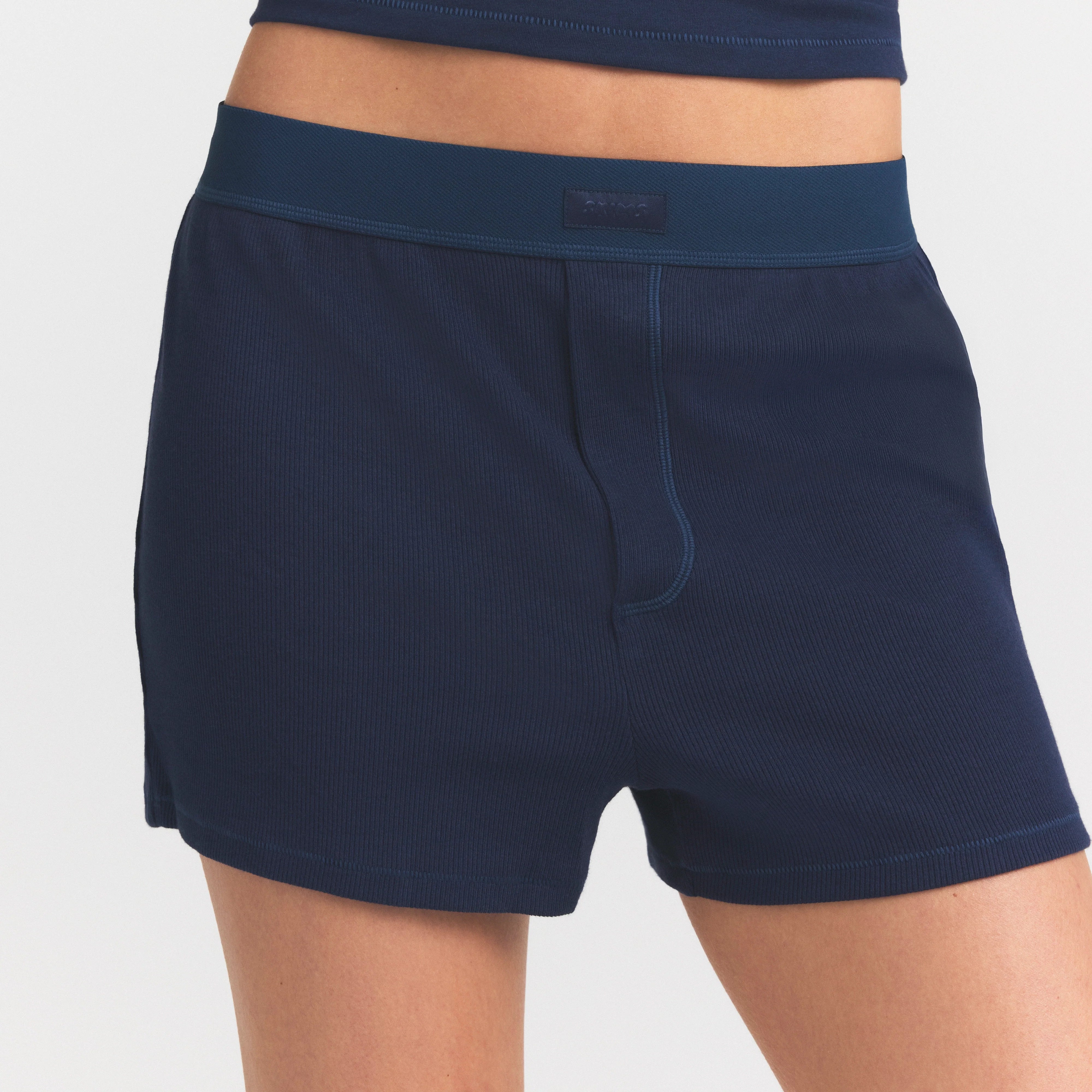 COTTON RIB LOOSE BOXER | NAVY ON A MODEL SIDE VIEW @ | FOCUS: 0.0, 1.0, 0.9