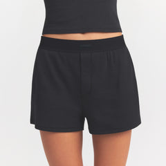 COTTON RIB LOOSE BOXER | SOOT ON A MODEL SIDE VIEW @ | FOCUS: 0.0, 1.0, 0.9